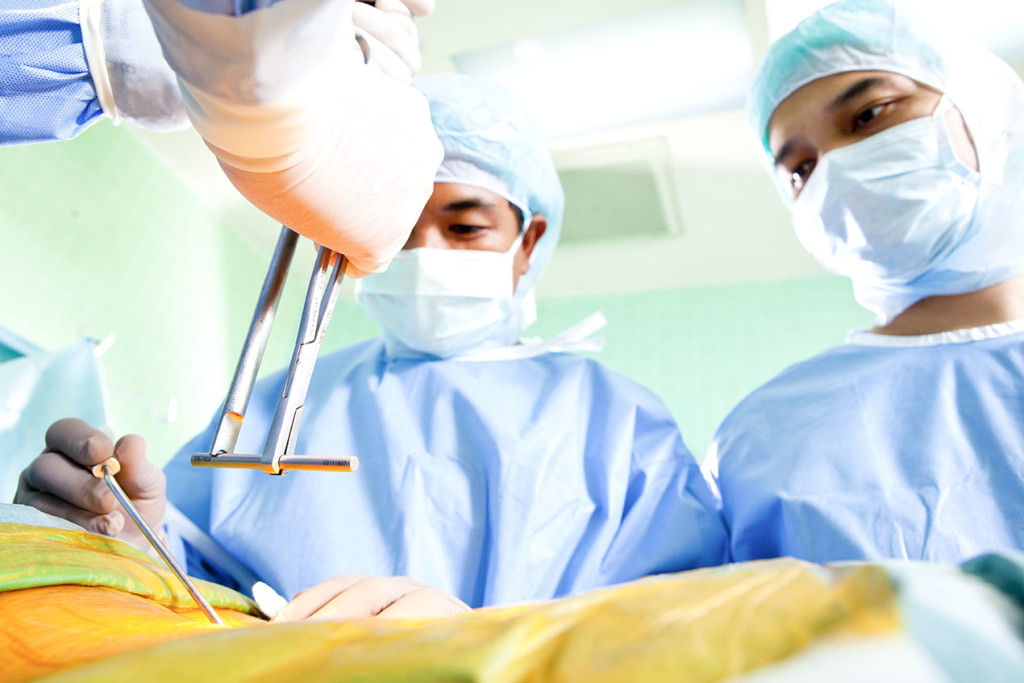 Photo of surgeons performing a laminectomy